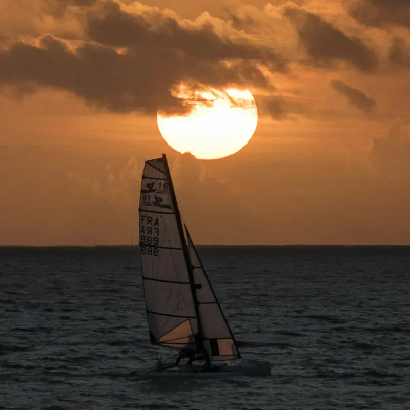 Sailboat Silhouette at Blazing Ocean Sunset Jigsaw Puzzle