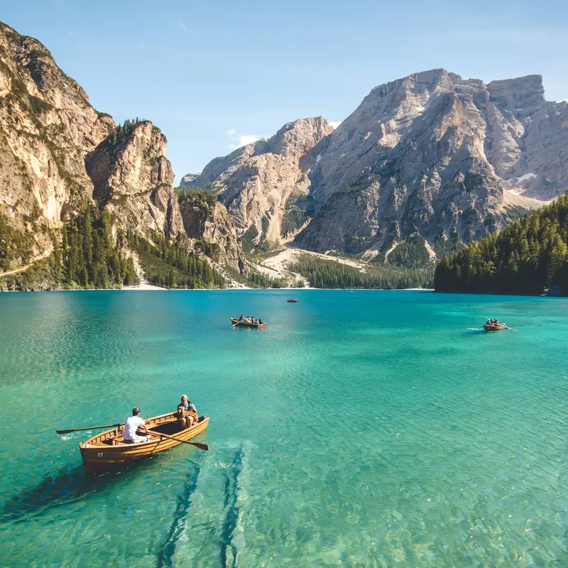 Wooden Boat on Turquoise Alpine Lake Jigsaw Puzzle