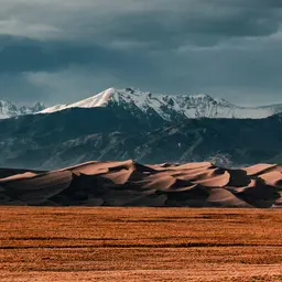 Sand Dunes Below Snow-Capped Mountains — Nature jigsaw puzzle